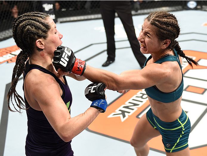 LAS VEGAS, NEVADA - DECEMBER 12: (R-L) Tecia Torres punches Angela Magana in their strawweight fight during The Ultimate Fighter Finale event inside the Pearl concert theater at the Palms Casino Resort on December 12, 2014 in Las Vegas, Nevada. (Photo by