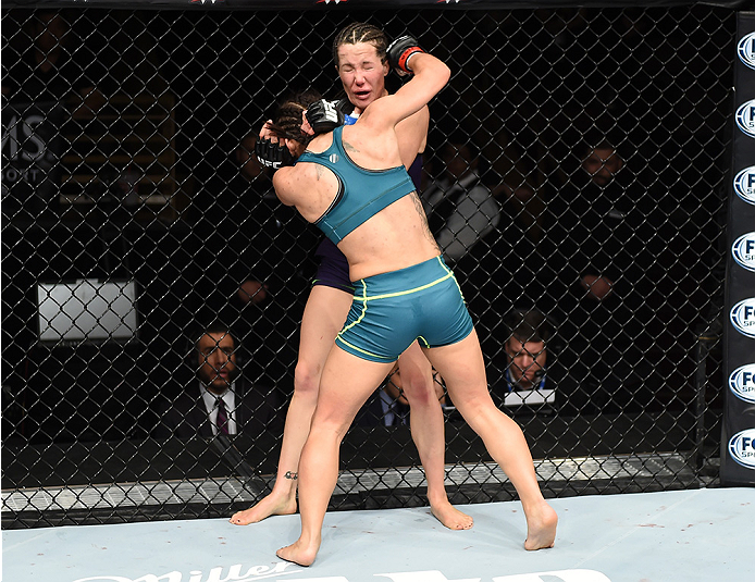 LAS VEGAS, NEVADA - DECEMBER 12: (L-R) Tecia Torres punches Angela Magana in their strawweight fight during The Ultimate Fighter Finale event inside the Pearl concert theater at the Palms Casino Resort on December 12, 2014 in Las Vegas, Nevada. (Photo by