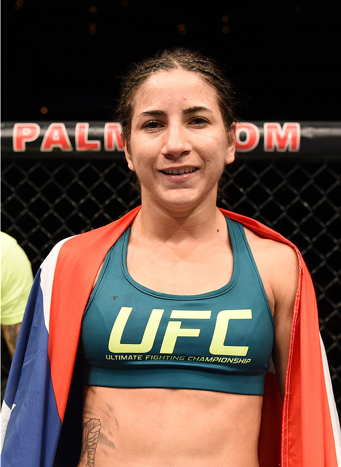 LAS VEGAS, NEVADA - DECEMBER 12: Tecia Torres celebrates her victory over Angela Magana in their strawweight fight during The Ultimate Fighter Finale event inside the Pearl concert theater at the Palms Casino Resort on December 12, 2014 in Las Vegas, Nev
