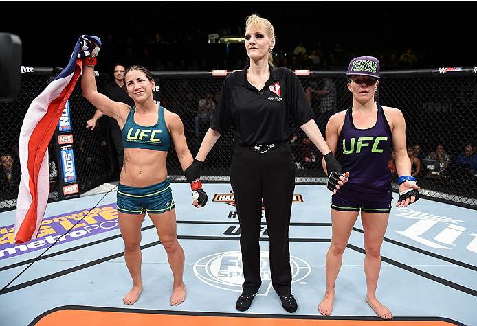 LAS VEGAS, NEVADA - DECEMBER 12: (L-R) Tecia Torres celebrates her victory over Angela Magana in their strawweight fight during The Ultimate Fighter Finale event inside the Pearl concert theater at the Palms Casino Resort on December 12, 2014 in Las Vega