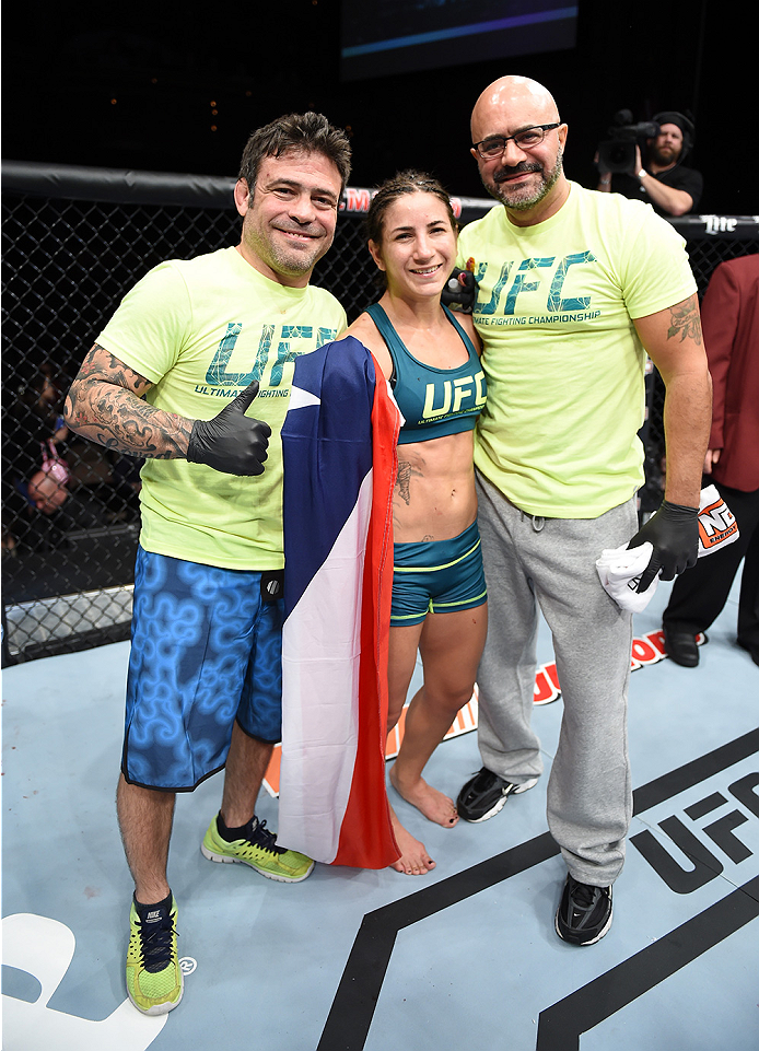 LAS VEGAS, NEVADA - DECEMBER 12: Tecia Torres celebrates her victory over Angela Magana in their strawweight fight during The Ultimate Fighter Finale event inside the Pearl concert theater at the Palms Casino Resort on December 12, 2014 in Las Vegas, Nev