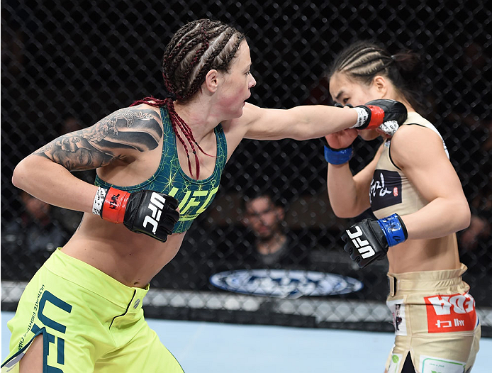 LAS VEGAS, NEVADA - DECEMBER 12: (L-R) Joanne Calderwood punches Seohee Ham in their strawweight fight during The Ultimate Fighter Finale event inside the Palms Casino Resort on December 12, 2014 in Las Vegas, Nevada. (Photo by Jeff Bottari/Zuffa LLC/Zuff