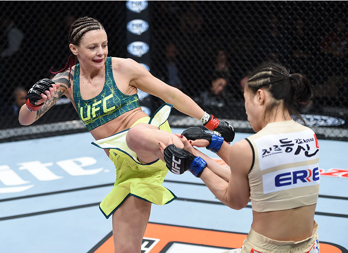 LAS VEGAS, NEVADA - DECEMBER 12: (L-R) Joanne Calderwood kicks Seohee Ham in their strawweight fight during The Ultimate Fighter Finale event inside the Palms Casino Resort on December 12, 2014 in Las Vegas, Nevada. (Photo by Jeff Bottari/Zuffa LLC/Zuffa