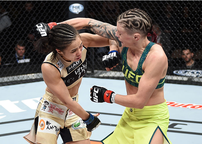 LAS VEGAS, NEVADA - DECEMBER 12: (R-L) Joanne Calderwood exchanges punches with Seohee Ham in their strawweight fight during The Ultimate Fighter Finale event inside the Palms Casino Resort on December 12, 2014 in Las Vegas, Nevada. (Photo by Jeff Bottari