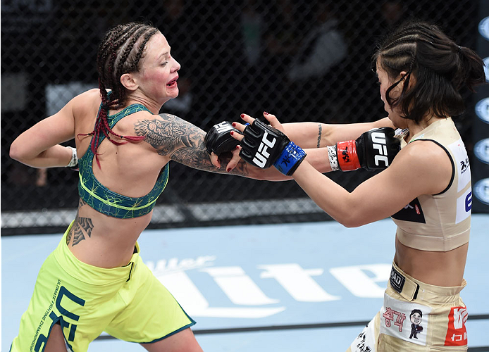 LAS VEGAS, NEVADA - DECEMBER 12: (L-R) Joanne Calderwood punches Seohee Ham in their strawweight fight during The Ultimate Fighter Finale event inside the Palms Casino Resort on December 12, 2014 in Las Vegas, Nevada. (Photo by Jeff Bottari/Zuffa LLC/Zuff