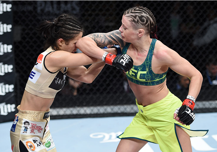 LAS VEGAS, NEVADA - DECEMBER 12: (R-L) Joanne Calderwood elbows Seohee Ham in their strawweight fight during The Ultimate Fighter Finale event inside the Palms Casino Resort on December 12, 2014 in Las Vegas, Nevada. (Photo by Jeff Bottari/Zuffa LLC/Zuffa