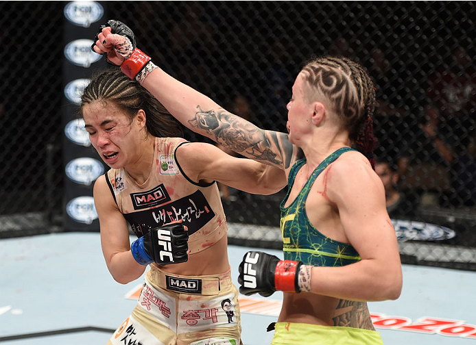 LAS VEGAS, NEVADA - DECEMBER 12: (R-L) Joanne Calderwood punches Seohee Ham in their strawweight fight during The Ultimate Fighter Finale event inside the Palms Casino Resort on December 12, 2014 in Las Vegas, Nevada. (Photo by Jeff Bottari/Zuffa LLC/Zuff
