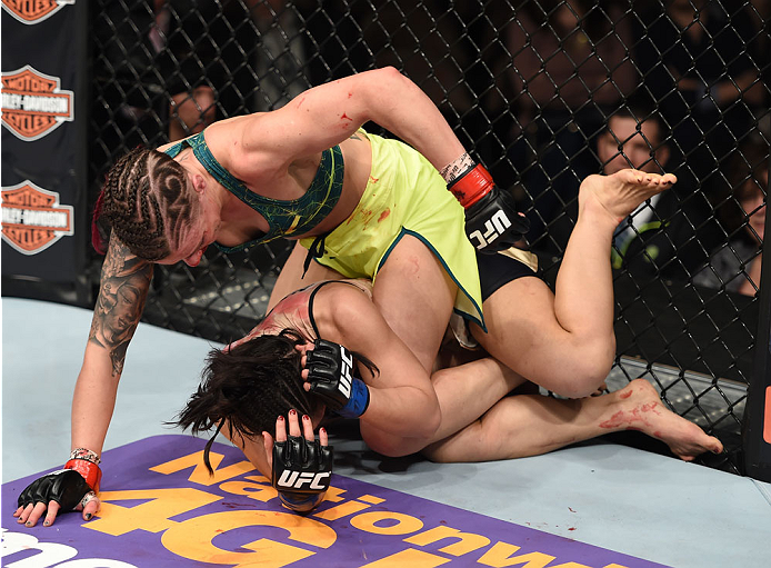 LAS VEGAS, NEVADA - DECEMBER 12: Joanne Calderwood (top) punches Seohee Ham in their strawweight fight during The Ultimate Fighter Finale event inside the Palms Casino Resort on December 12, 2014 in Las Vegas, Nevada. (Photo by Jeff Bottari/Zuffa LLC/Zuff