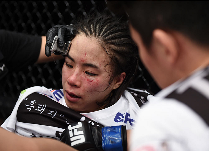 LAS VEGAS, NEVADA - DECEMBER 12: Seohee Ham sits in her corner after her fight against Joanne Calderwood in their strawweight fight during The Ultimate Fighter Finale event inside the Palms Casino Resort on December 12, 2014 in Las Vegas, Nevada. (Photo