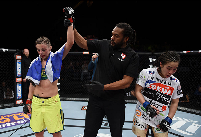 LAS VEGAS, NEVADA - DECEMBER 12: (L-R) Joanne Calderwood celebrates her victory over Seohee Ham in their strawweight fight during The Ultimate Fighter Finale event inside the Palms Casino Resort on December 12, 2014 in Las Vegas, Nevada. (Photo by Jeff Bo