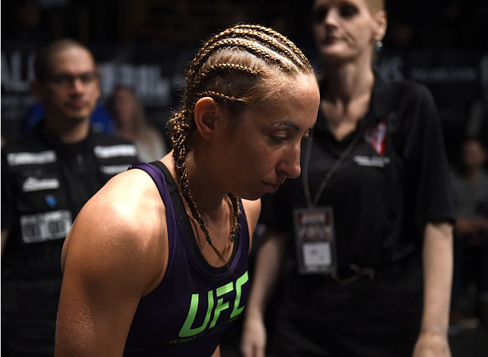 LAS VEGAS, NEVADA - DECEMBER 12: Heather Jo Clark prepares to enter the Octagon before facing Bec Rawlings in their strawweight fight during The Ultimate Fighter Finale event inside the Pearl concert theater at the Palms Casino Resort on December 12, 2014