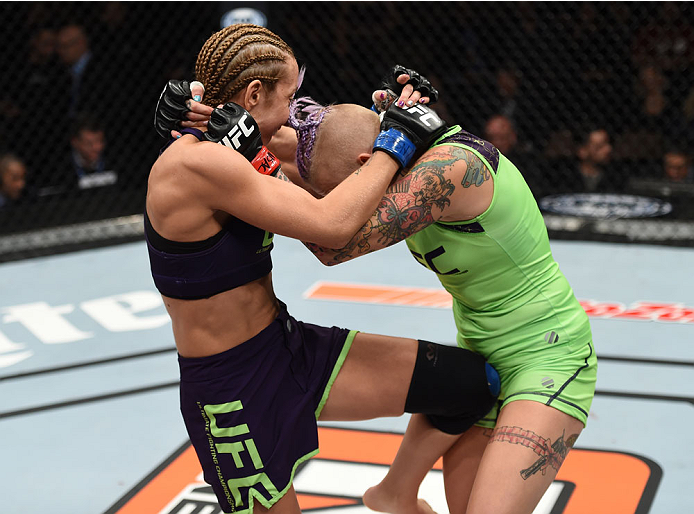 LAS VEGAS, NEVADA - DECEMBER 12: (L-R) Heather Jo Clark knees Bec Rawlings in their strawweight fight during The Ultimate Fighter Finale event inside the Pearl concert theater at the Palms Casino Resort on December 12, 2014 in Las Vegas, Nevada. (Photo by