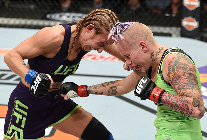 LAS VEGAS, NEVADA - DECEMBER 12: (L-R) Heather Jo Clark punches Bec Rawlings in their strawweight fight during The Ultimate Fighter Finale event inside the Pearl concert theater at the Palms Casino Resort on December 12, 2014 in Las Vegas, Nevada. (Photo