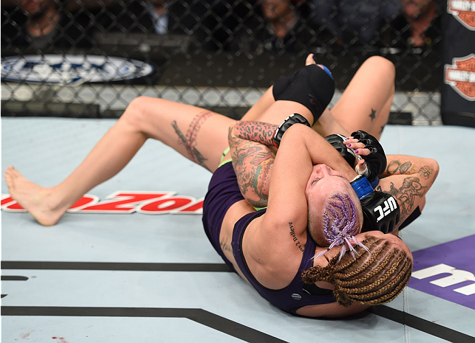 LAS VEGAS, NEVADA - DECEMBER 12: Heather Jo Clark attempts to submit Bec Rawlings in their strawweight fight during The Ultimate Fighter Finale event inside the Pearl concert theater at the Palms Casino Resort on December 12, 2014 in Las Vegas, Nevada. (P