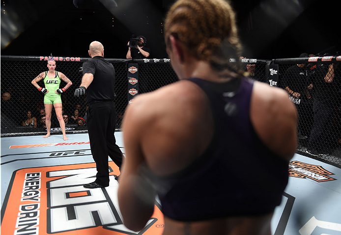 LAS VEGAS, NEVADA - DECEMBER 12: (R-L) Heather Jo Clark looks across the cage at Bec Rawlings in their strawweight fight during The Ultimate Fighter Finale event inside the Pearl concert theater at the Palms Casino Resort on December 12, 2014 in Las Vegas