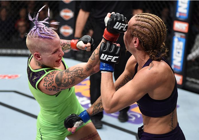 LAS VEGAS, NEVADA - DECEMBER 12: (L-R) Bec Rawlings punches Heather Jo Clark in their strawweight fight during The Ultimate Fighter Finale event inside the Pearl concert theater at the Palms Casino Resort on December 12, 2014 in Las Vegas, Nevada. (Photo
