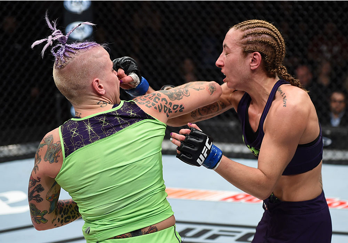 LAS VEGAS, NEVADA - DECEMBER 12: (L-R) Bec Rawlings elbows Heather Jo Clark in their strawweight fight during The Ultimate Fighter Finale event inside the Pearl concert theater at the Palms Casino Resort on December 12, 2014 in Las Vegas, Nevada. (Photo b
