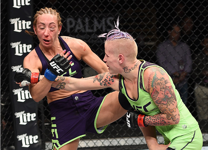 LAS VEGAS, NEVADA - DECEMBER 12: (R-L) Bec Rawlings punches Heather Jo Clark in their strawweight fight during The Ultimate Fighter Finale event inside the Pearl concert theater at the Palms Casino Resort on December 12, 2014 in Las Vegas, Nevada. (Photo