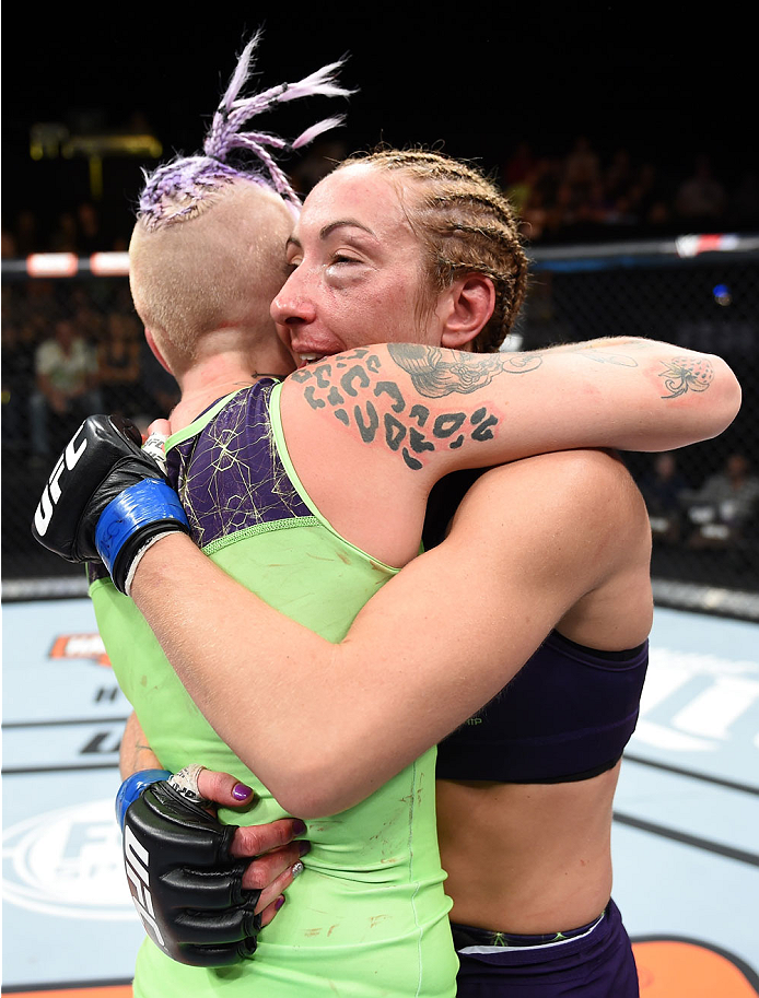 LAS VEGAS, NEVADA - DECEMBER 12: (R-L) Heather Jo Clark hugs Bec Rawlings after their strawweight fight during The Ultimate Fighter Finale event inside the Pearl concert theater at the Palms Casino Resort on December 12, 2014 in Las Vegas, Nevada. (Photo