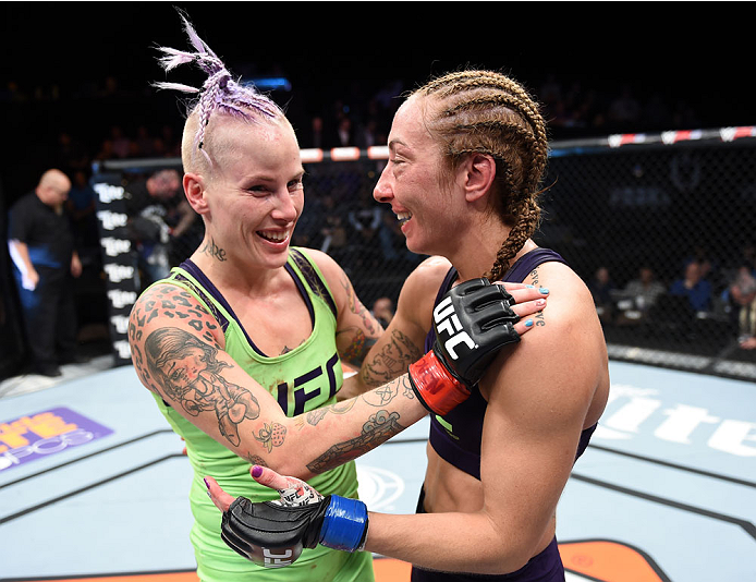 LAS VEGAS, NEVADA - DECEMBER 12: (R-L) Heather Jo Clark hugs Bec Rawlings after their strawweight fight during The Ultimate Fighter Finale event inside the Pearl concert theater at the Palms Casino Resort on December 12, 2014 in Las Vegas, Nevada. (Photo