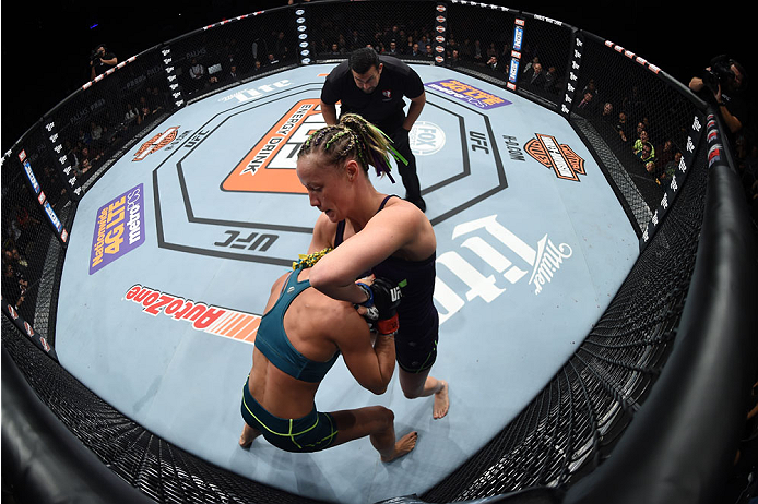 LAS VEGAS, NEVADA - DECEMBER 12: (R-L) Lisa Ellis attempts to submit Felice Heerig in their strawweight fight during The Ultimate Fighter Finale event inside the Pearl concert theater at the Palms Casino Resort on December 12, 2014 in Las Vegas, Nevada. (