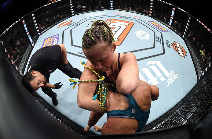 LAS VEGAS, NEVADA - DECEMBER 12: (R-L) Lisa Ellis attempts to submit Felice Heerig in their strawweight fight during The Ultimate Fighter Finale event inside the Pearl concert theater at the Palms Casino Resort on December 12, 2014 in Las Vegas, Nevada. (