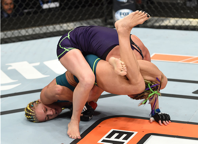LAS VEGAS, NEVADA - DECEMBER 12: (L-R) Felice Herrig attempts to submit Lisa Ellis in their strawweight fight during The Ultimate Fighter Finale event inside the Pearl concert theater at the Palms Casino Resort on December 12, 2014 in Las Vegas, Nevada. (