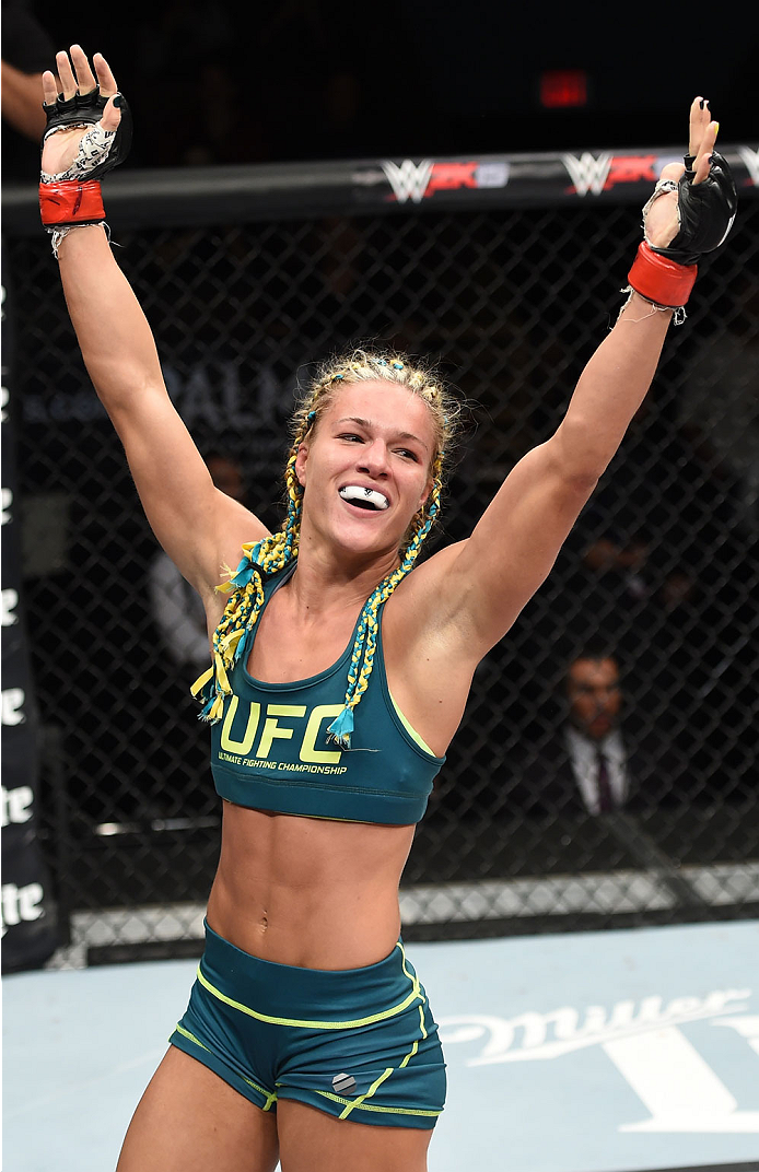 LAS VEGAS, NEVADA - DECEMBER 12: Felice Herrig celebrates her submission victory over Lisa Ellis in their strawweight fight during The Ultimate Fighter Finale event inside the Pearl concert theater at the Palms Casino Resort on December 12, 2014 in Las V