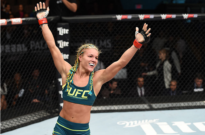 LAS VEGAS, NEVADA - DECEMBER 12: Felice Herrig celebrates her submission victory over Lisa Ellis in their strawweight fight during The Ultimate Fighter Finale event inside the Pearl concert theater at the Palms Casino Resort on December 12, 2014 in Las V