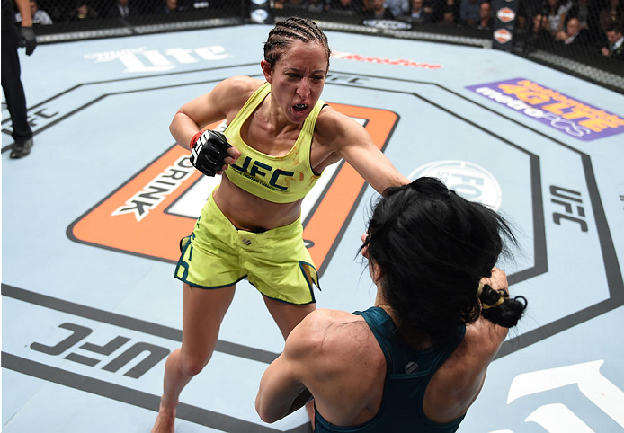 LAS VEGAS, NEVADA - DECEMBER 12: (L-R) Jessica Penne punches Randa Markos in their strawweight fight during The Ultimate Fighter Finale event inside the Pearl concert theater at the Palms Casino Resort on December 12, 2014 in Las Vegas, Nevada. (Photo by
