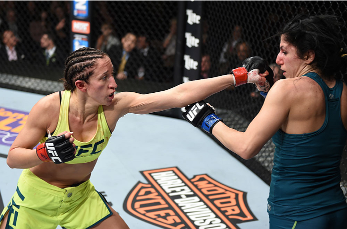 LAS VEGAS, NEVADA - DECEMBER 12: (L-R) Jessica Penne punches Randa Markos in their strawweight fight during The Ultimate Fighter Finale event inside the Pearl concert theater at the Palms Casino Resort on December 12, 2014 in Las Vegas, Nevada. (Photo by