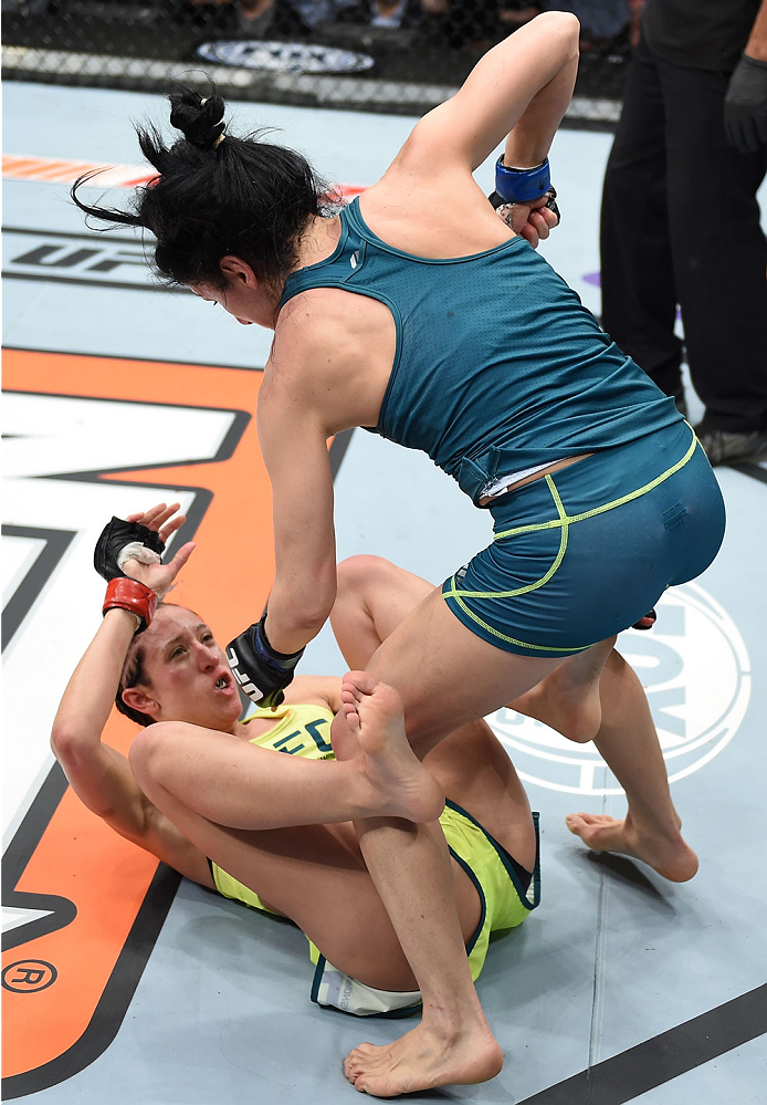 LAS VEGAS, NEVADA - DECEMBER 12: (R-L) Randa Markos punches Jessica Penne in their strawweight fight during The Ultimate Fighter Finale event inside the Pearl concert theater at the Palms Casino Resort on December 12, 2014 in Las Vegas, Nevada. (Photo by