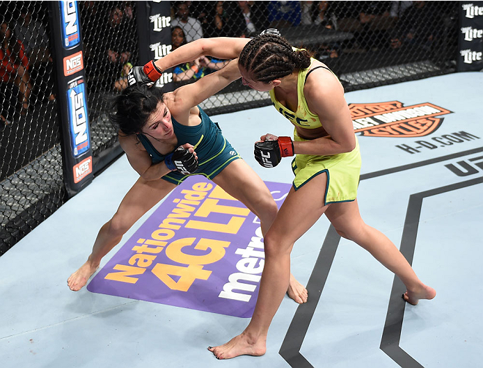 LAS VEGAS, NEVADA - DECEMBER 12: (R-L) Jessica Penne exchanges punches with Randa Markos in their strawweight fight during The Ultimate Fighter Finale event inside the Pearl concert theater at the Palms Casino Resort on December 12, 2014 in Las Vegas, Ne
