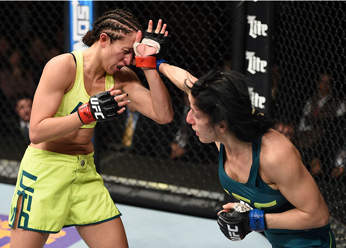 LAS VEGAS, NEVADA - DECEMBER 12: (R-L) Randa Markos punches Jessica Penne in their strawweight fight during The Ultimate Fighter Finale event inside the Pearl concert theater at the Palms Casino Resort on December 12, 2014 in Las Vegas, Nevada. (Photo by