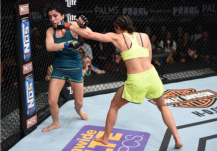 LAS VEGAS, NEVADA - DECEMBER 12: (R-L) Jessica Penne exchanges punches with Randa Markos in their strawweight fight during The Ultimate Fighter Finale event inside the Pearl concert theater at the Palms Casino Resort on December 12, 2014 in Las Vegas, Ne