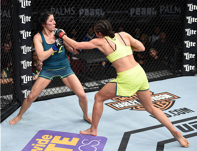 LAS VEGAS, NEVADA - DECEMBER 12: (R-L) Jessica Penne exchanges punches with Randa Markos in their strawweight fight during The Ultimate Fighter Finale event inside the Pearl concert theater at the Palms Casino Resort on December 12, 2014 in Las Vegas, Ne