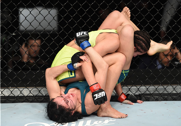 LAS VEGAS, NEVADA - DECEMBER 12: Randa Markos attempts to submit Jessica Penne in their strawweight fight during The Ultimate Fighter Finale event inside the Pearl concert theater at the Palms Casino Resort on December 12, 2014 in Las Vegas, Nevada. (Pho