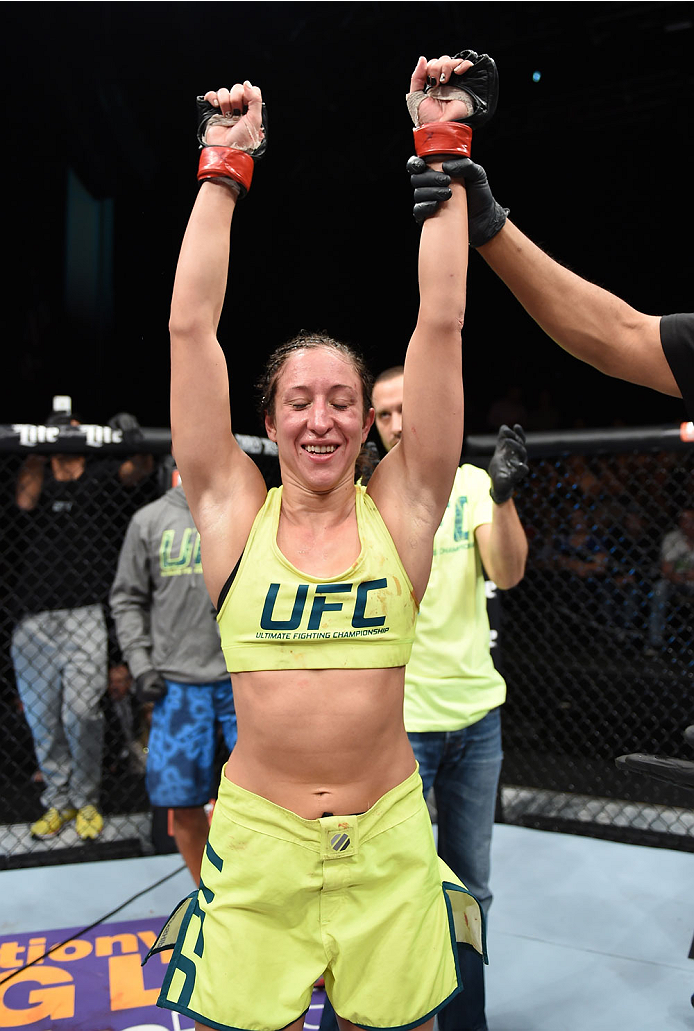 LAS VEGAS, NEVADA - DECEMBER 12: Jessica Penne celebrates her victory over Randa Markos in their strawweight fight during The Ultimate Fighter Finale event inside the Pearl concert theater at the Palms Casino Resort on December 12, 2014 in Las Vegas, Nev