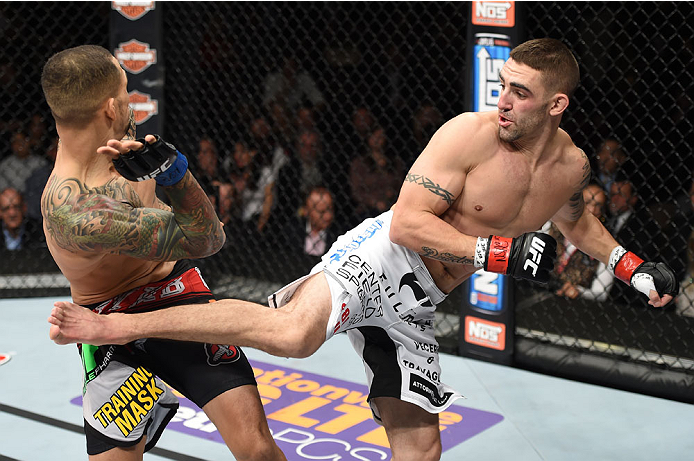 LAS VEGAS, NEVADA - DECEMBER 12: (R-L) Joe Proctor kicks Yancy Medeiros in their lightweight fight during The Ultimate Fighter Finale event inside the Pearl concert theater at the Palms Casino Resort on December 12, 2014 in Las Vegas, Nevada. (Photo by Je