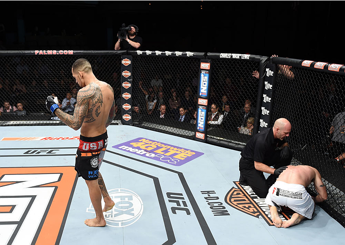 LAS VEGAS, NEVADA - DECEMBER 12: (L-R) Yancy Medeiros celebrates his submission victory over Joe Proctor in their lightweight fight during The Ultimate Fighter Finale event inside the Pearl concert theater at the Palms Casino Resort on December 12, 2014 i