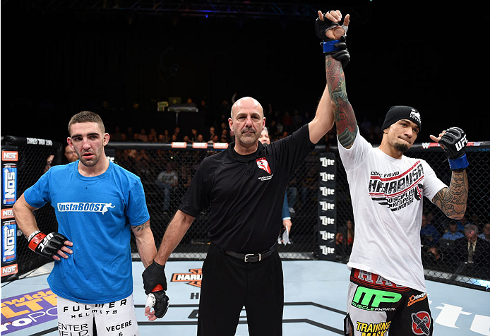 LAS VEGAS, NEVADA - DECEMBER 12: (R-L)Yancy Medeiros celebrates his submission victory over Joe Proctor in their lightweight fight during The Ultimate Fighter Finale event inside the Pearl concert theater at the Palms Casino Resort on December 12, 2014 in