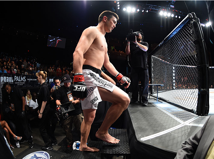 LAS VEGAS, NEVADA - DECEMBER 12: KJ Noons prepares to enter the Octagon before facing Daron Cruickshank in their lightweight fight during The Ultimate Fighter Finale event inside the Pearl concert theater at the Palms Casino Resort on December 12, 2014 in