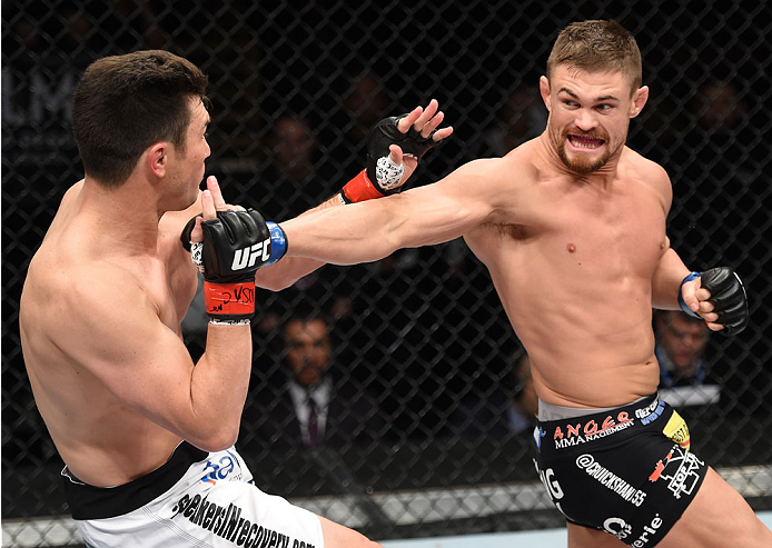 LAS VEGAS, NEVADA - DECEMBER 12: (R-L) Daron Cruickshank throws a spinning back fist at KJ Noons in their lightweight fight during The Ultimate Fighter Finale event inside the Pearl concert theater at the Palms Casino Resort on December 12, 2014 in Las Ve