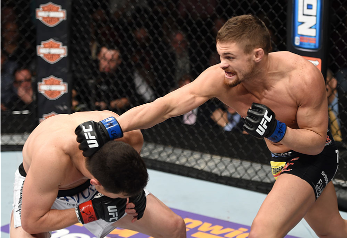 LAS VEGAS, NEVADA - DECEMBER 12: (R-L) Daron Cruickshank punches KJ Noons in their lightweight fight during The Ultimate Fighter Finale event inside the Pearl concert theater at the Palms Casino Resort on December 12, 2014 in Las Vegas, Nevada. (Photo by