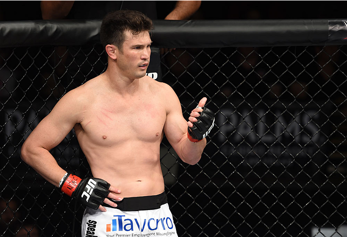LAS VEGAS, NEVADA - DECEMBER 12: KJ Noons signals to Daron Cruickshank after an accidental eye poke in their lightweight fight during The Ultimate Fighter Finale event inside the Pearl concert theater at the Palms Casino Resort on December 12, 2014 in Las