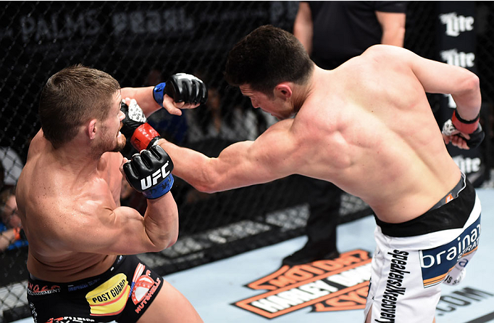 LAS VEGAS, NEVADA - DECEMBER 12: (R-L) KJ Noons punches Daron Cruickshank in their lightweight fight during The Ultimate Fighter Finale event inside the Pearl concert theater at the Palms Casino Resort on December 12, 2014 in Las Vegas, Nevada. (Photo by