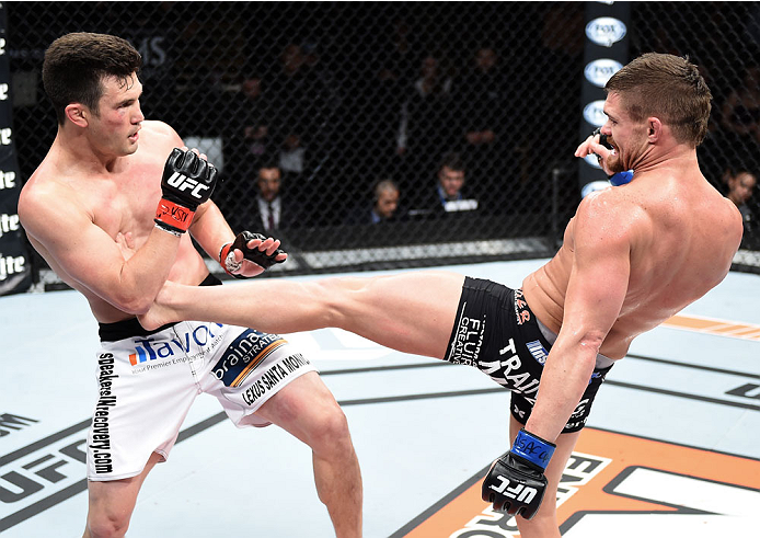 LAS VEGAS, NEVADA - DECEMBER 12: (R-L) Daron Cruickshank kicks KJ Noons in their lightweight fight during The Ultimate Fighter Finale event inside the Pearl concert theater at the Palms Casino Resort on December 12, 2014 in Las Vegas, Nevada. (Photo by Je
