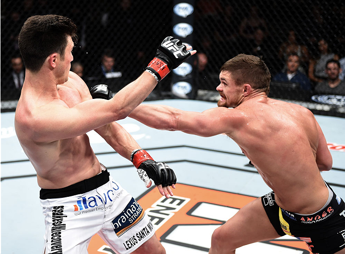 LAS VEGAS, NEVADA - DECEMBER 12: (R-L) Daron Cruickshank punches KJ Noons in their lightweight fight during The Ultimate Fighter Finale event inside the Pearl concert theater at the Palms Casino Resort on December 12, 2014 in Las Vegas, Nevada. (Photo by