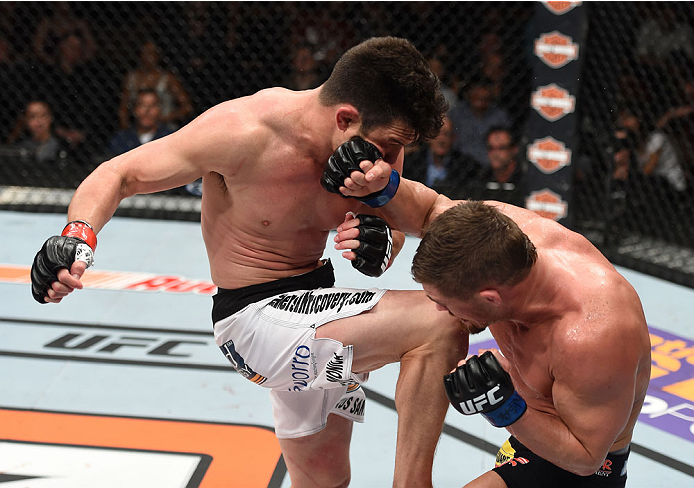LAS VEGAS, NEVADA - DECEMBER 12: (L-R) KJ Noons knees Daron Cruickshank in their lightweight fight during The Ultimate Fighter Finale event inside the Pearl concert theater at the Palms Casino Resort on December 12, 2014 in Las Vegas, Nevada. (Photo by Je