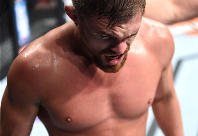 LAS VEGAS, NEVADA - DECEMBER 12: Daron Cruickshank walks to his corner after an accidental eye poke from KJ Noons in their lightweight fight during The Ultimate Fighter Finale event inside the Pearl concert theater at the Palms Casino Resort on December 1